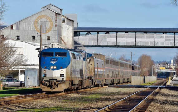 Amongst this week’s notes; the FRA intends to reinforce highway grade crossing safety. Amtrak’s train #11, the Coast Starlight, roars over an example in Kent, Washington on February 20th. Image © Nikki Burgess 2/2016; all rights reserved.