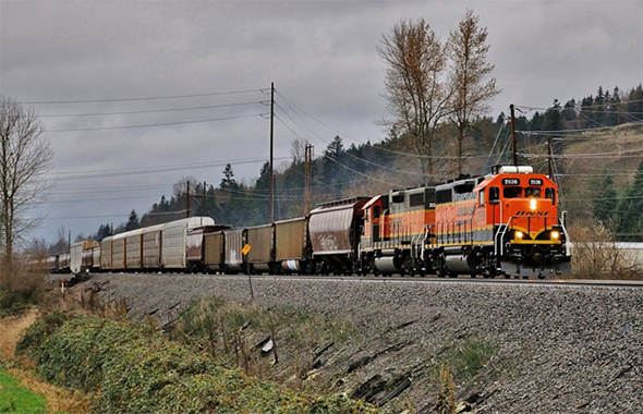 The FRA has changed its contact procedures in the event of rail-related incidents. BNSF’s Job 2 Local makes its way south through rainy Sumner, Washington on December 11th, 2016. Image © 12/2016 by Nikki Burgess; all rights reserved.