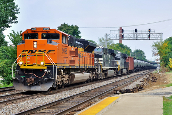 The FRA issued an Emergency Information Collection Request (EICR) in reference to the repairs it directed shippers to make to the nation’s fleet of DOT-111 rail tank cars last week. A train of such cars passes west through Hinsdale, Illinois in August of 2014. Image © 8/2014 by Nikki Burgess; all rights reserved.