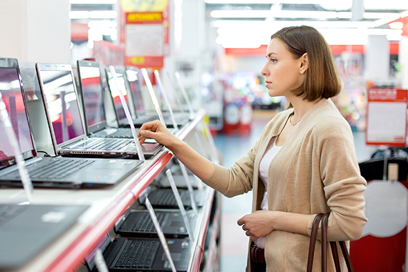 woman chooses a laptop